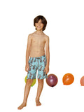 Boy's swim trunks printed in a spray of pineapples, front view